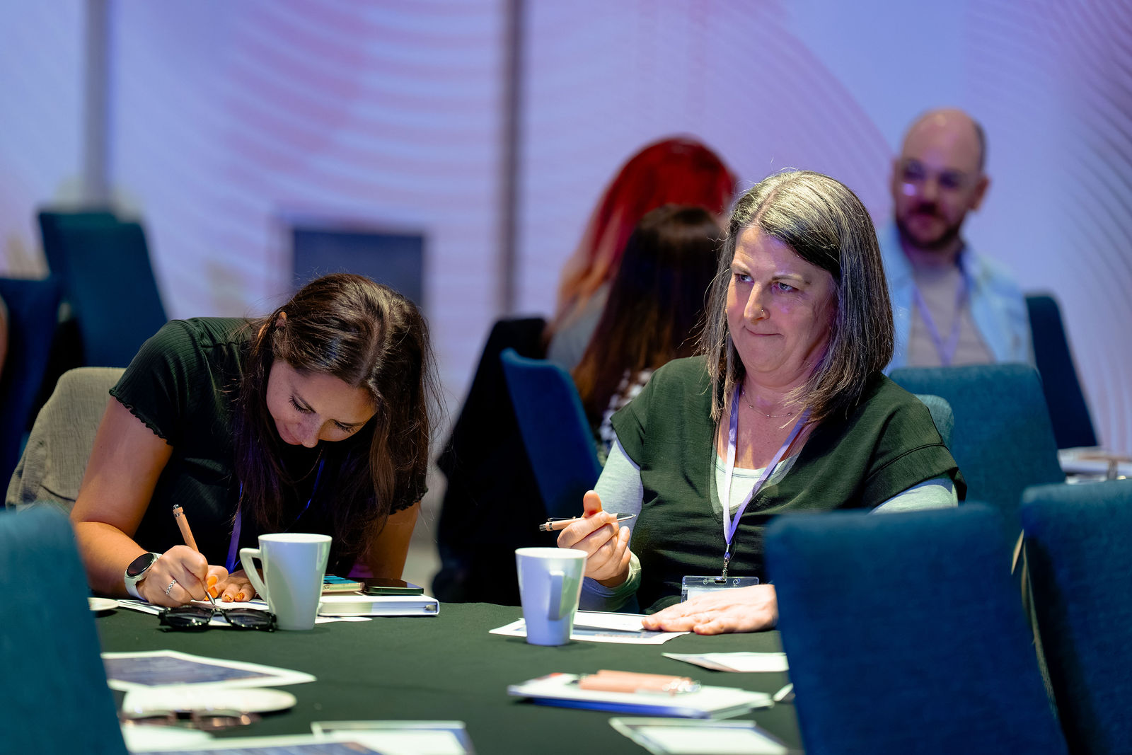 Participants making notes during a session.