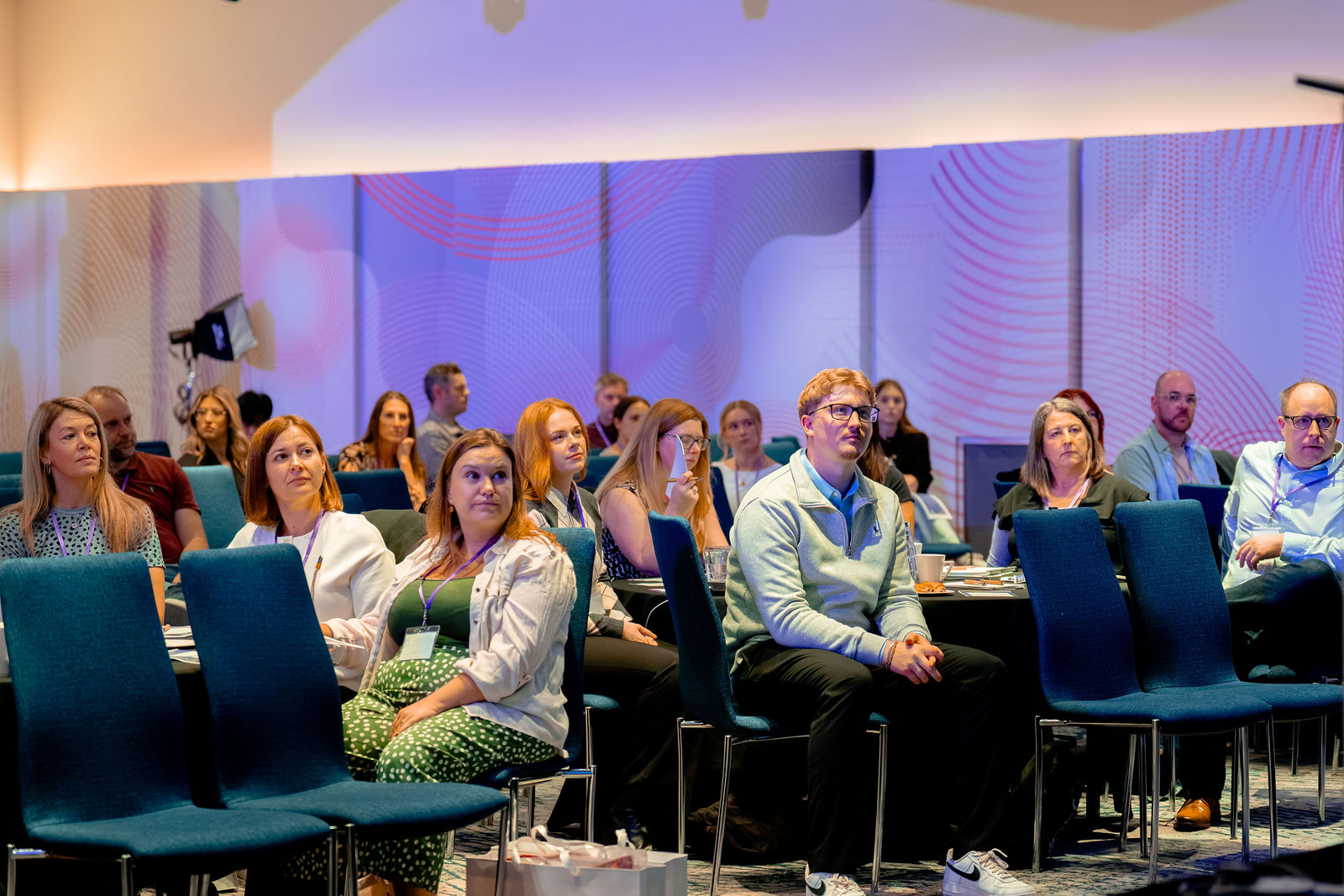 The audience following a presentation in the main room.