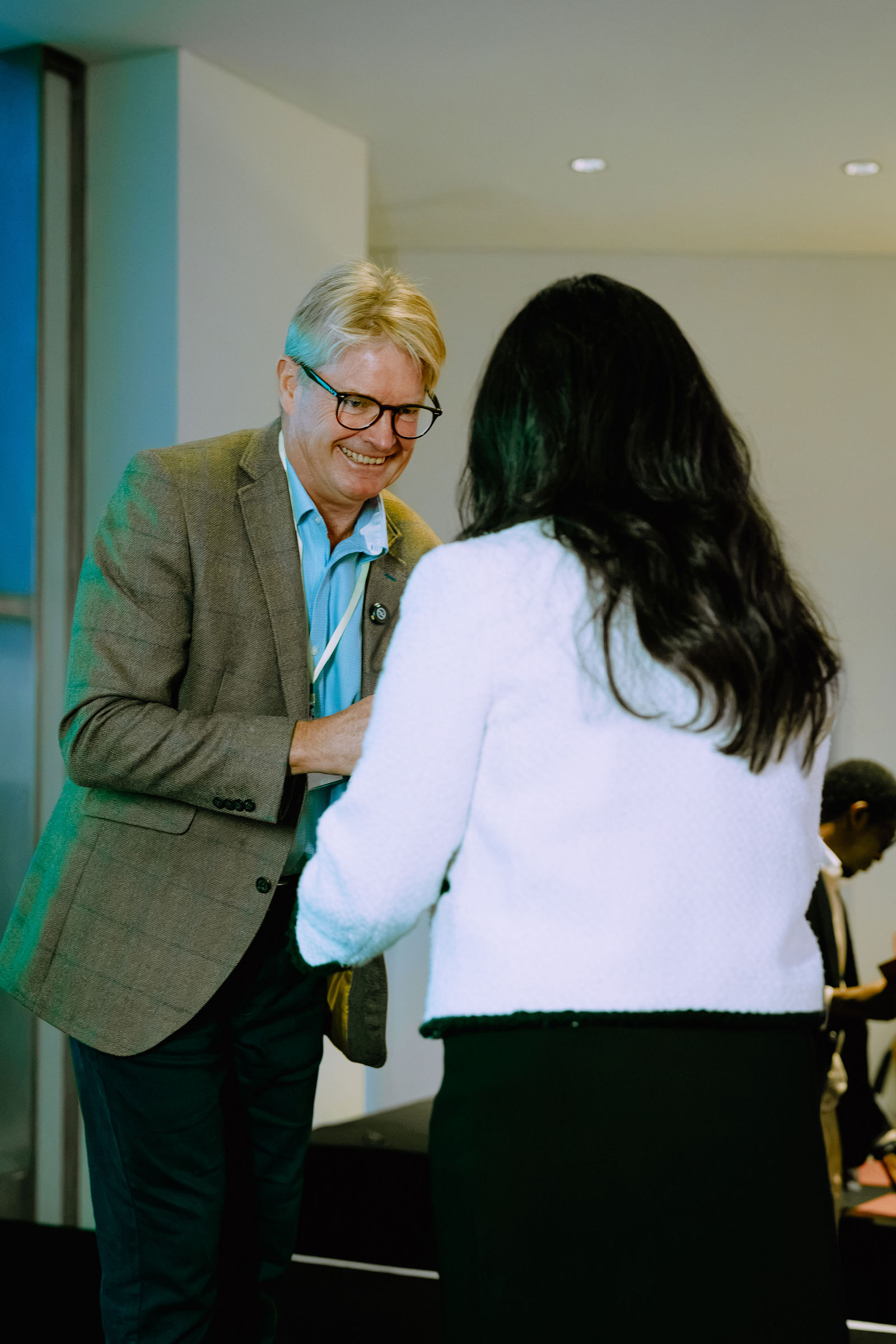 A congratulatory moment during the certificate presentations.