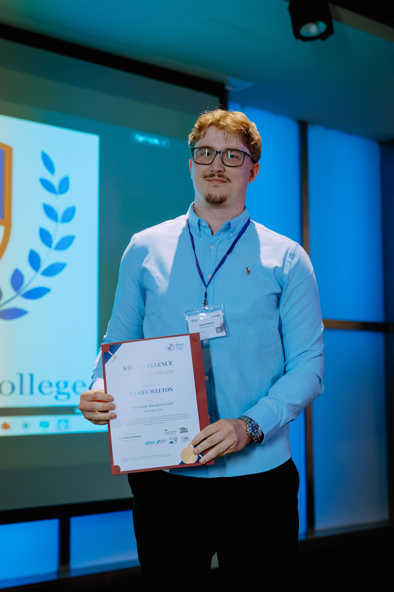 A certificate recipient celebrates at the London Masterclass.