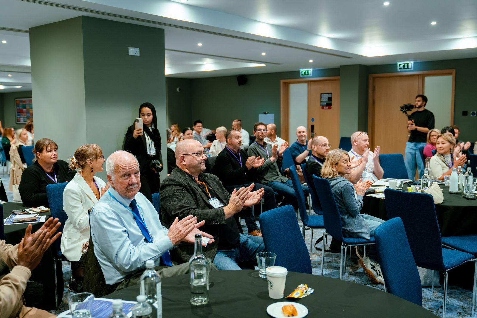 Delegates applaud during the London Masterclass.