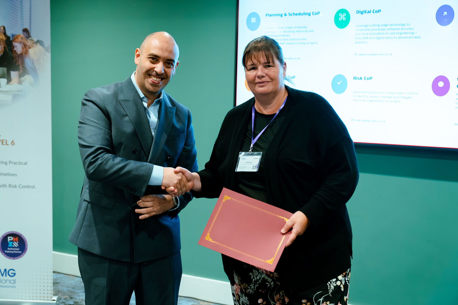 Congratulations during a London Masterclass recognition presentation.
